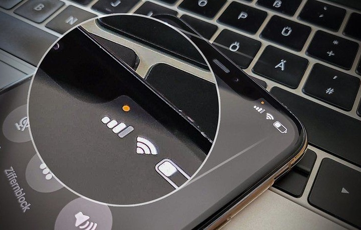 Что означают зеленая и оранжевая точки на экране iPhone